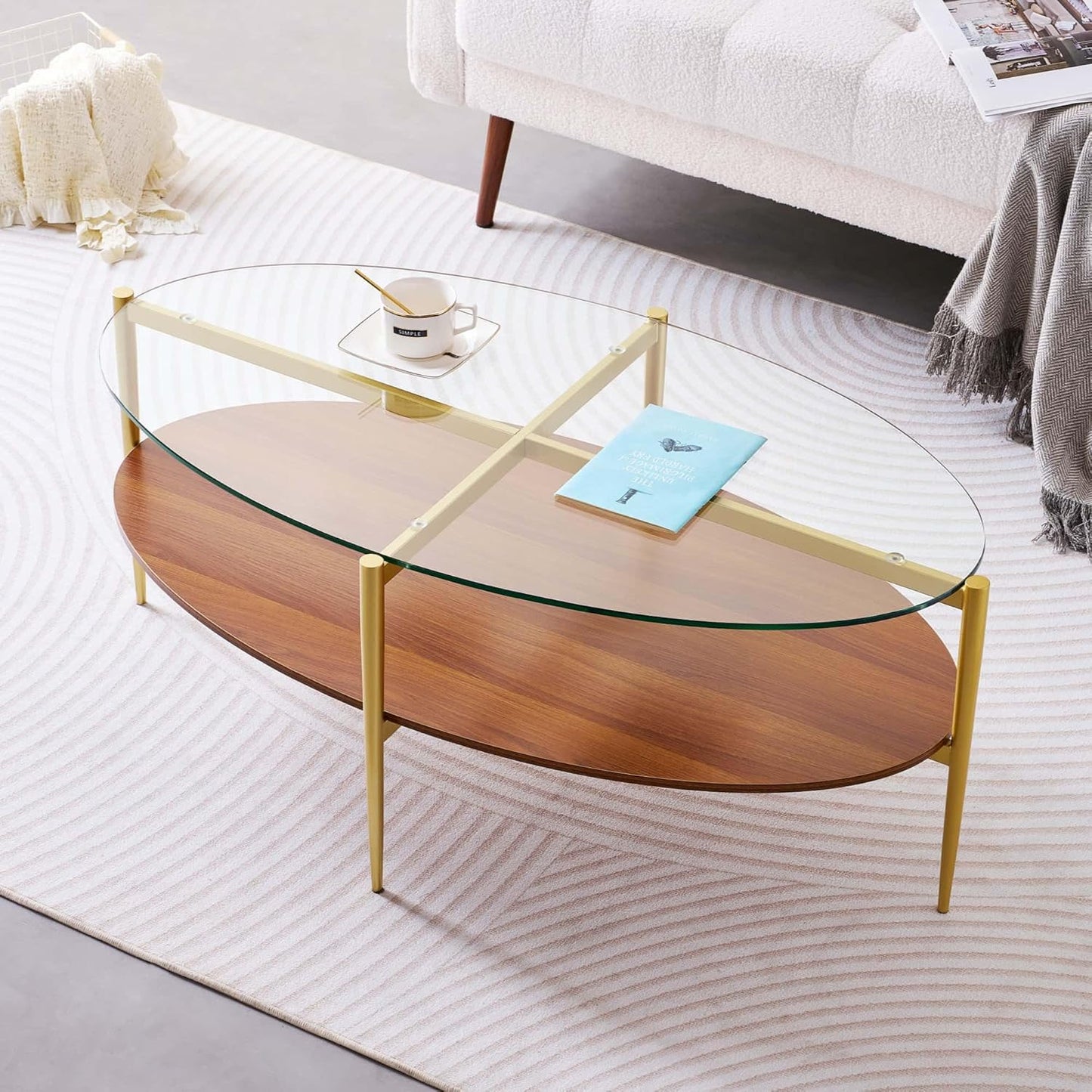 Oval Glass Coffee Table, Mid-Century Modern Design, L43 x W22 x H17 inch, 2-Tier Structure, Olive Shaped Clear Glass Top and Walnut Finish Wood Shelf, Tapered Legs with Gold Finish Frame