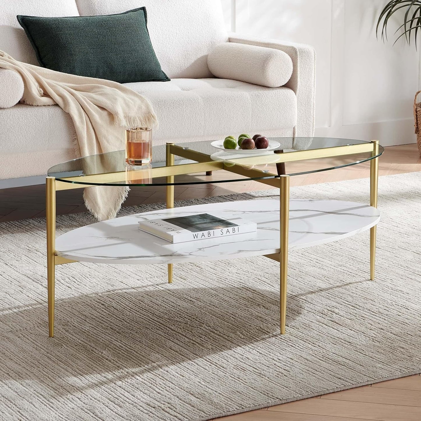 Oval Glass Coffee Table, Mid-Century Modern Design, L43 x W22 x H17 inch, Surfboard Shaped Clear Glass Top and White Marble Finish Wood Shelf, Tapered Legs with Gold Finish Frame