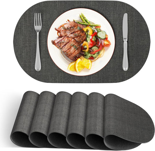 DOLOPL Placemats Set of 6, Oval Reversible Wipeable & Heat Resistant Place Mats, Modern Faux Leather Table Mats for Kitchen, Neutral Tablemats for Dining Table Decor, Wedding, Party(Charcoal)