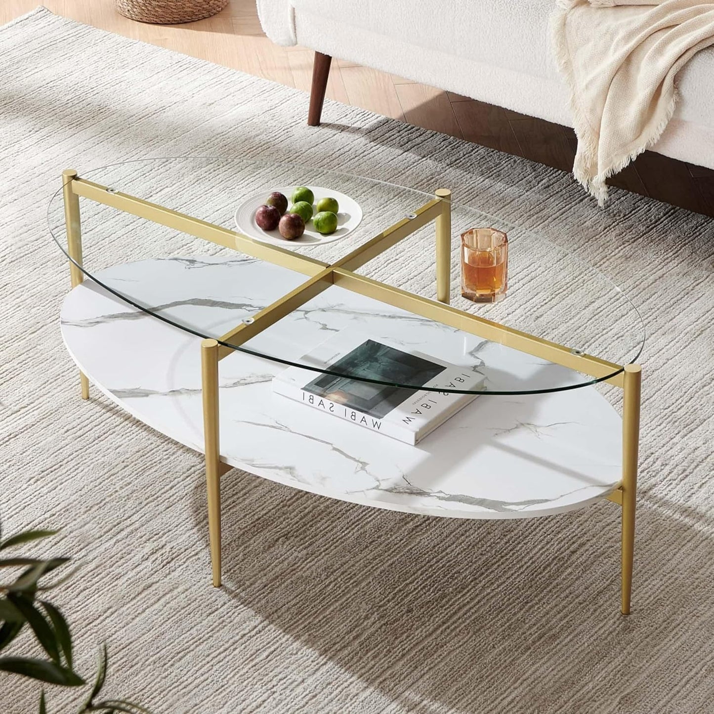 Oval Glass Coffee Table, Mid-Century Modern Design, L43 x W22 x H17 inch, Surfboard Shaped Clear Glass Top and White Marble Finish Wood Shelf, Tapered Legs with Gold Finish Frame